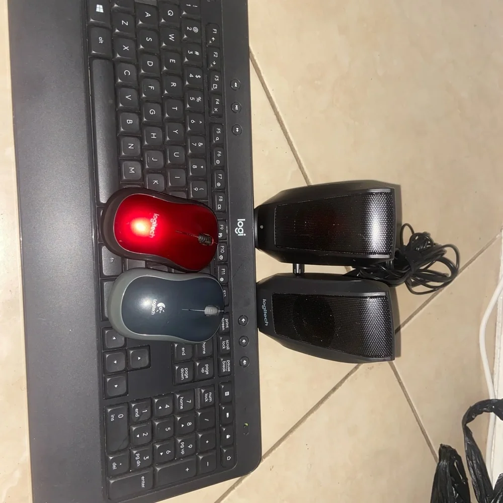 Logitech Black Keyboard with Red Mouse and Speakers